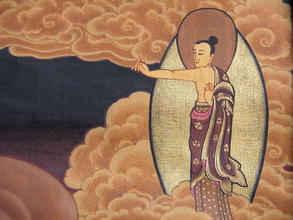 Tibetan Buddhism Wheel Of Life 01 Buddha Upper Right In the upper right corner of the painting outside the wheel, Buddha is standing with his left hand in a fearlessness mudra and with the index finger of the right hand pointing to the other side at the top left, pointing to the path out of the wheel.